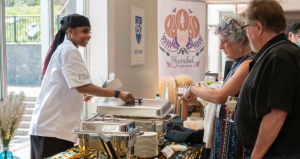 One of the SPICE participants - an African Nova Scotian women, serving food at their business