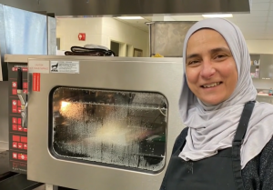 Basma Rashad, standing beside an oven
