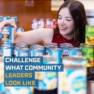 Cheyenne Hardy arranging cans with the text "Challenge what Community Leaders Look Like" 