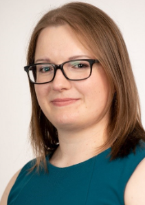 Dr. Svenja Huntemann posing for a headshot photo. She is wearing glasses and a teal top with shoulder-length hair