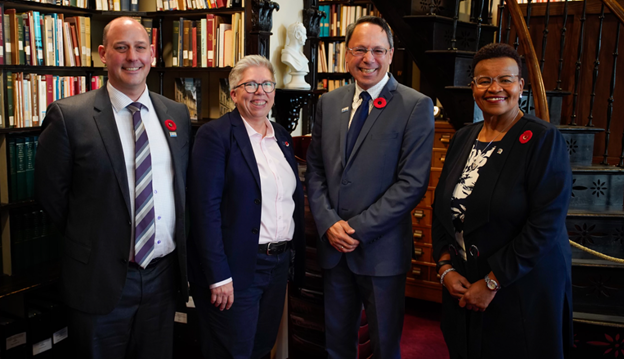 Minister of Education the Honourable Brian Wong welcoming Dr. Dickinson, at the Nova Scotia Legisature