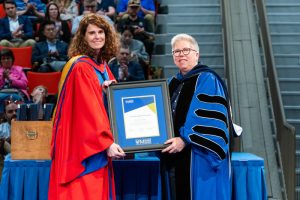 Christine Doe receiving the Presidents and Vice Presidents' Advanced Career Teaching Award