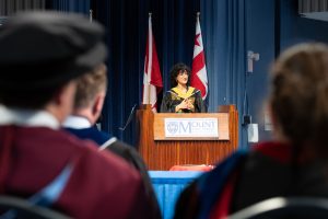 Lily Brigham-Gale giving the Valedictorian speech at the Thursday morning convocation ceremony