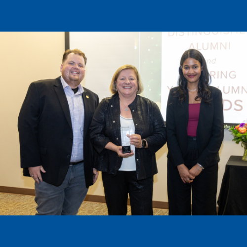 from left, UPEI Alumni Association President Ronnie McPhee, Dr. Janice Keefe holding the Distinguished Alumni Award, UPEI Alumni Association Vice President Leena Daboo 