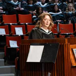 Katie Bates, the morning valedictorian for the Fall 2025 Ceremony, speaking at the podium.
