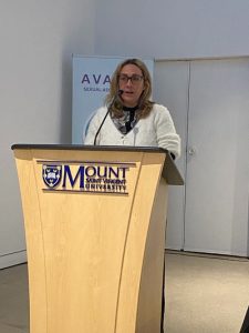Tegan Zimmerman, Chair of the Alexa McDonough Institute for Women, Gender & Social Justice, giving the opening remarks at the National Day of Remembrance