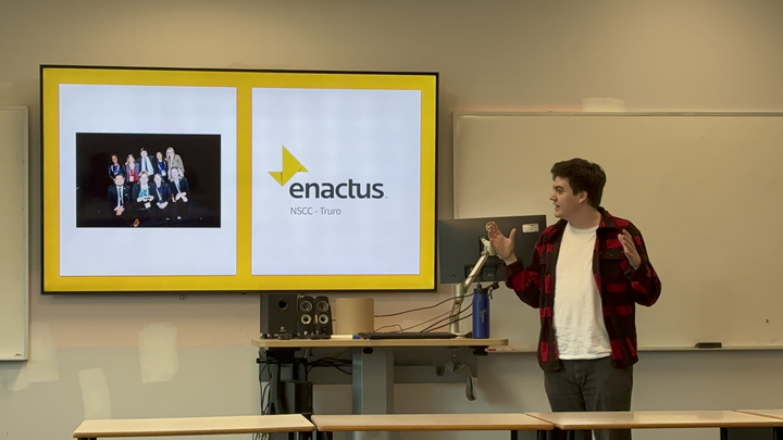 Tanner delivering a presentation about enactus