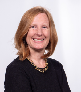 Jeannie Bail, the MSVU University Librarian, smiling for a headshot photo. Wearing a black sweater and a gold necklace.