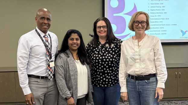 Daphne Pereira, second from left, standing beside the Three minute Thesis judges