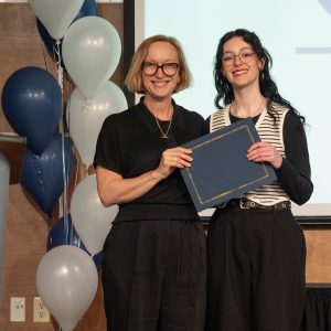 Megan Beckner receiving the Psychology Student Leadership Award