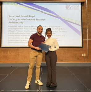 Esther Minani, receiving the Susan and Russell Boyd Undergraduate Student Research Assistantship