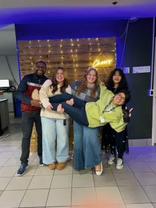 Orinari posing for a group photo beside several MSVU Students' Union staff members