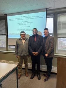 Orinari standing beside Dr. Sarah Reddington and Dr. Fernando Nunes