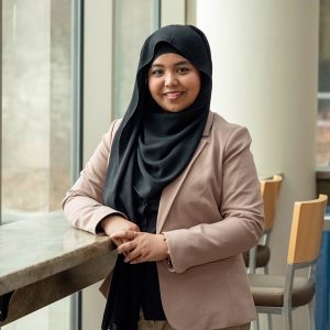 Ummay Siddiqua Moutushi, wearing a cream-coloured blazer and a black hijab