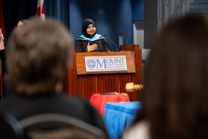 Ummay Siddiqua Moutushi - speaking at the podium for the Spring 2026 Convocation ceremony